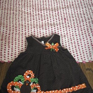 Festive Brown Polka Dot Dress with Orange and Green Accents